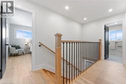 Extra wide staircase with iron balusters - 