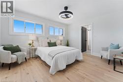 Spacious primary with loads of natural light, walk-in closet, & ensuite. - 