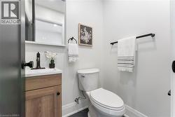 Convenient 2pc bath with upgraded ceramic tile flooring. - 