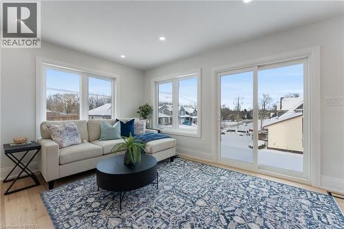 Bright & airy open concept space with feature wall. - 50 Fife Street W, Caledonia, ON - Indoor Photo Showing Living Room