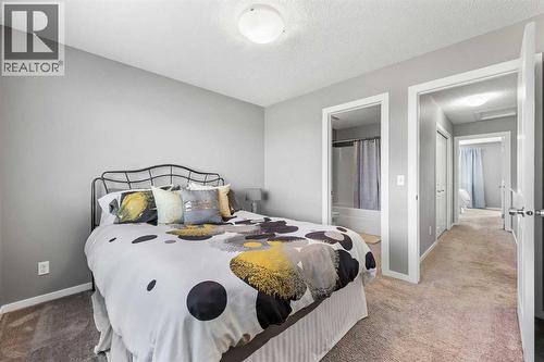 68 New Brighton Point Se, Calgary, AB - Indoor Photo Showing Bedroom