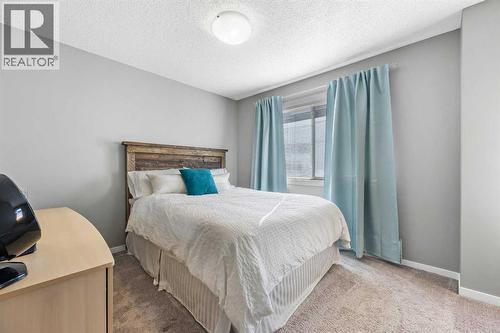 68 New Brighton Point Se, Calgary, AB - Indoor Photo Showing Bedroom