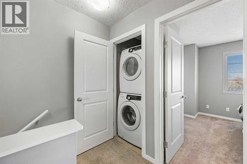 68 New Brighton Point Se, Calgary, AB - Indoor Photo Showing Laundry Room