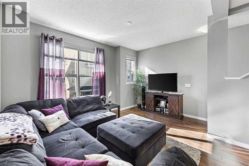68 New Brighton Point Se, Calgary, AB - Indoor Photo Showing Living Room