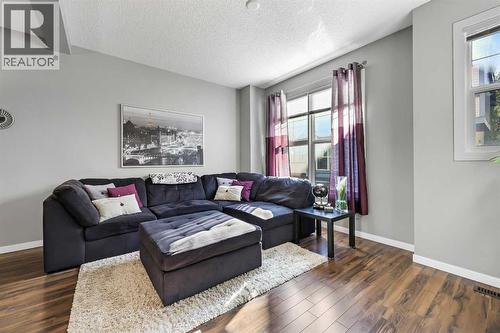 68 New Brighton Point Se, Calgary, AB - Indoor Photo Showing Living Room