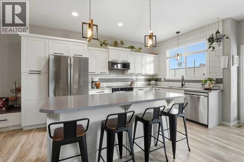 135 Hampton Crescent, Sylvan Lake, AB - Indoor Photo Showing Kitchen With Stainless Steel Kitchen With Upgraded Kitchen