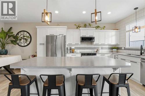 135 Hampton Crescent, Sylvan Lake, AB - Indoor Photo Showing Kitchen With Stainless Steel Kitchen With Upgraded Kitchen