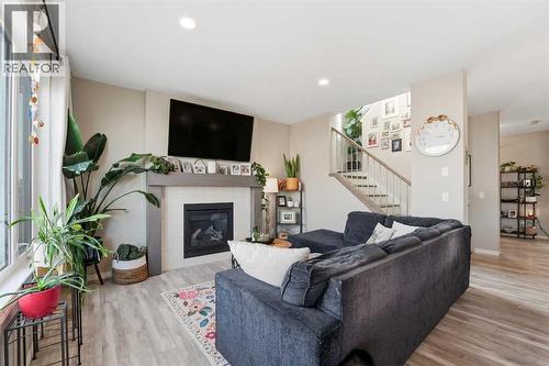 135 Hampton Crescent, Sylvan Lake, AB - Indoor Photo Showing Living Room With Fireplace