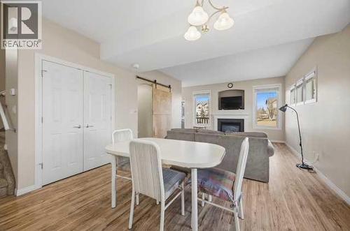 Dining Area - 408, 150 Vanier Drive, Red Deer, AB - Indoor Photo Showing Dining Room With Fireplace