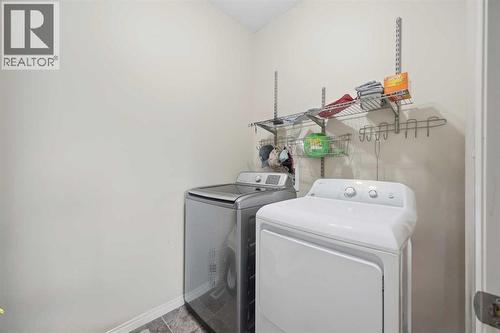 Washer dryer on main level - 408, 150 Vanier Drive, Red Deer, AB - Indoor Photo Showing Laundry Room