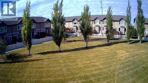Greenspace to the north of the home - 408, 150 Vanier Drive, Red Deer, AB - Outdoor With Facade