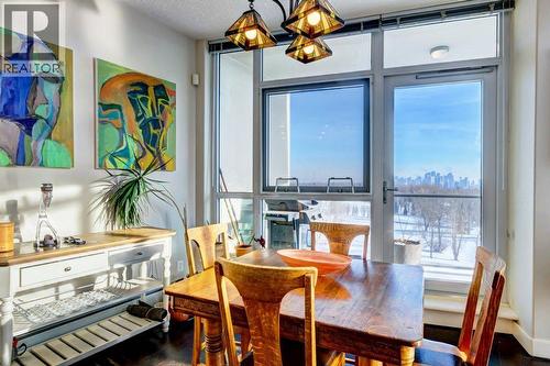 Dinner with a view - 602, 99 Spruce Place Sw, Calgary, AB - Indoor Photo Showing Dining Room