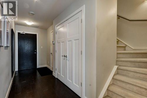 Main floor entry & stairs to 2nd level - 602, 99 Spruce Place Sw, Calgary, AB - Indoor Photo Showing Other Room
