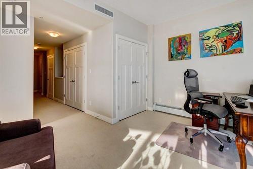 upper level with 2nd entry/exit to elevators - 602, 99 Spruce Place Sw, Calgary, AB - Indoor Photo Showing Office