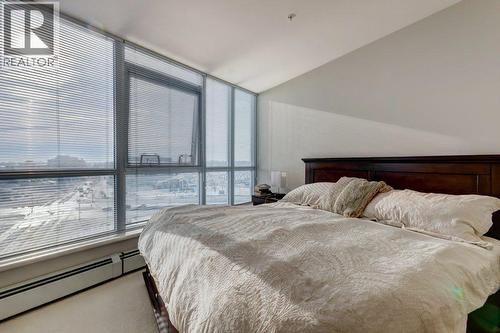 Primary bedroom upper level - 602, 99 Spruce Place Sw, Calgary, AB - Indoor Photo Showing Bedroom