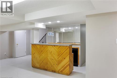 Basement features a built-in bar—perfect for entertaining. - 391 Strawberry Crescent, Waterloo, ON - Indoor