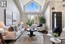Sunken living room with soaring cathedral ceilings and abundant natural light, creating a bright and welcoming space. - 391 Strawberry Crescent, Waterloo, ON  - Indoor Photo Showing Living Room 
