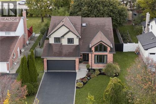 Located within walking distance to St. Matthew Catholic School and minutes to parks, trails, playgrounds, shopping, Conestoga Mall, and major commuter routes, this home delivers the lifestyle and conv - 391 Strawberry Crescent, Waterloo, ON - Outdoor With Facade