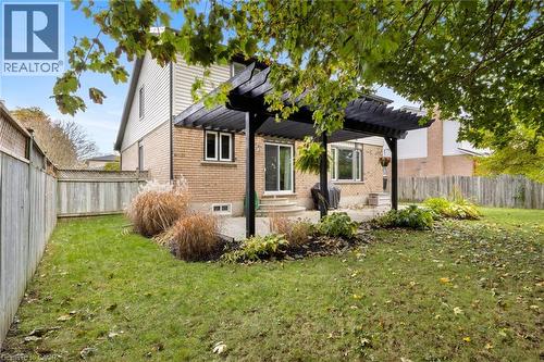 Backyard pergola creates a shaded outdoor space ideal for relaxing or entertaining. - 391 Strawberry Crescent, Waterloo, ON - Outdoor