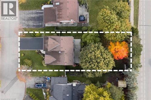 0.2-acre lot for the area, featuring mature trees and a fully fenced backyard. - 391 Strawberry Crescent, Waterloo, ON -  With View