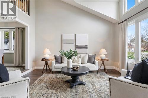 Cathedral ceilings and abundant natural light create a bright, open, and spacious feel. - 391 Strawberry Crescent, Waterloo, ON - Indoor Photo Showing Living Room