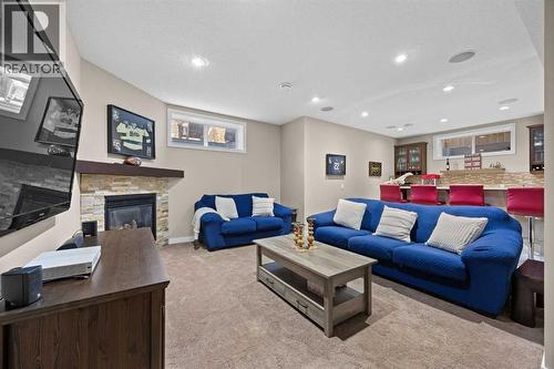 202 Royal Oak Heath Nw, Calgary, AB - Indoor Photo Showing Living Room With Fireplace