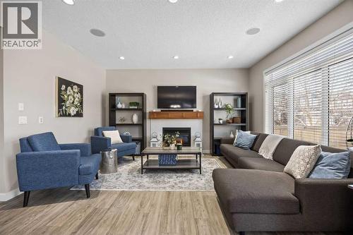 202 Royal Oak Heath Nw, Calgary, AB - Indoor Photo Showing Living Room With Fireplace