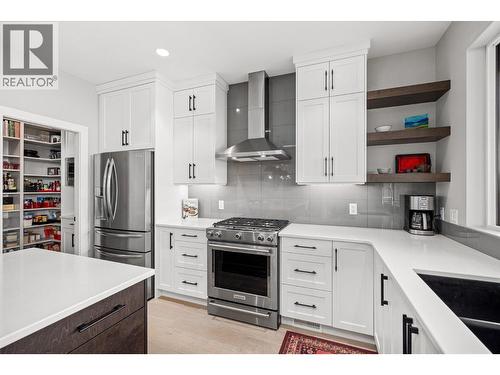 Premium stainless steel appliances (gas range) - 468 Sparrow Hawk Court, Kelowna, BC - Indoor Photo Showing Kitchen With Upgraded Kitchen