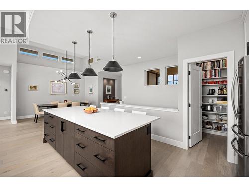 Oversized sit-up quartz island - 468 Sparrow Hawk Court, Kelowna, BC - Indoor Photo Showing Kitchen