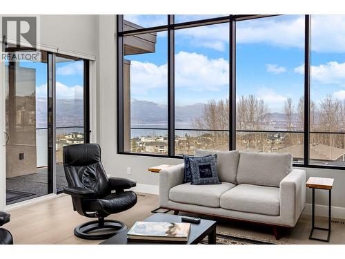 A wall of windows to frame the stunning views...complete with auto blinds! - 468 Sparrow Hawk Court, Kelowna, BC -  Photo Showing Other Room
