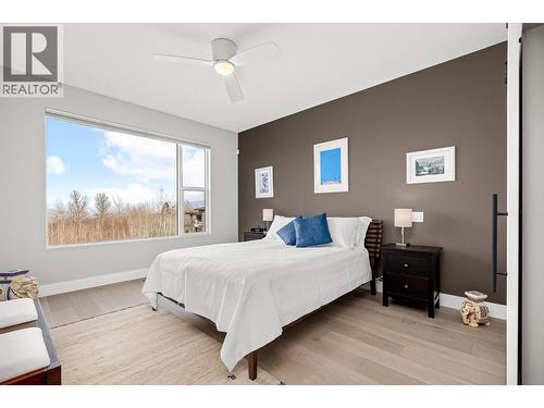 Large Primary bedroom with gorgeous lake views - 468 Sparrow Hawk Court, Kelowna, BC - Indoor Photo Showing Bedroom