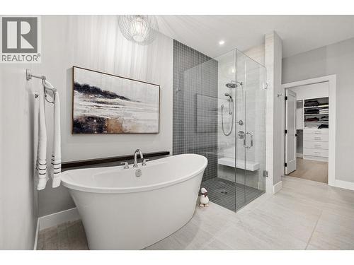 Soaker tub, custom glass & tile walk-in shower with a built-in bench and a water closet - 468 Sparrow Hawk Court, Kelowna, BC - Indoor Photo Showing Bathroom