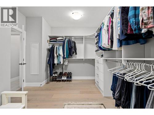 Generous walk-in closet with custom built-ins - 468 Sparrow Hawk Court, Kelowna, BC - Indoor With Storage