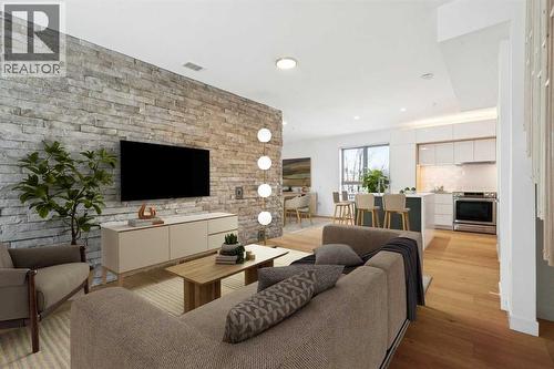 205, 116 7A Street Ne, Calgary, AB - Indoor Photo Showing Living Room