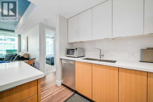 410, 560 6 Avenue Se, Calgary, AB - Indoor Photo Showing Kitchen With Double Sink