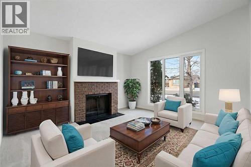 987 Berkley Drive Nw, Calgary, AB - Indoor Photo Showing Living Room With Fireplace
