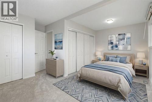 large primary bedroom - virtually staged - 987 Berkley Drive Nw, Calgary, AB - Indoor Photo Showing Bedroom