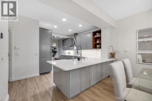 12, 10 St Julien Drive Sw, Calgary, AB - Indoor Photo Showing Kitchen With Upgraded Kitchen