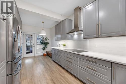 12, 10 St Julien Drive Sw, Calgary, AB - Indoor Photo Showing Kitchen With Upgraded Kitchen