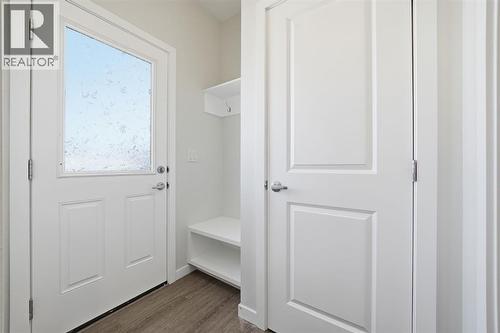 Back Entrance with Bench - 292 Cornerbrook Drive Ne, Calgary, AB - Indoor Photo Showing Other Room