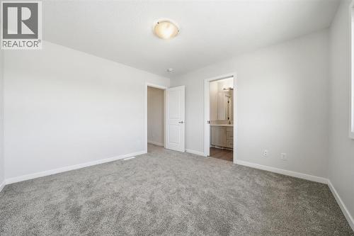 Master Bed - 292 Cornerbrook Drive Ne, Calgary, AB - Indoor Photo Showing Other Room
