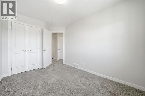Bed Closet - 292 Cornerbrook Drive Ne, Calgary, AB - Indoor Photo Showing Other Room