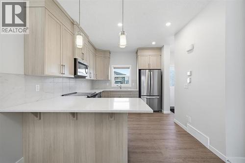 Quartz Counter Tops - 292 Cornerbrook Drive Ne, Calgary, AB - Indoor Photo Showing Kitchen With Upgraded Kitchen
