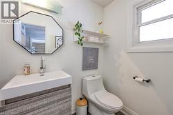 Half bathroom with toilet and vanity - 