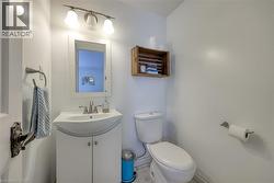 Half bathroom with toilet and vanity - 
