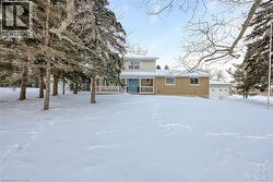Traditional-style home with brick siding and a porch - 