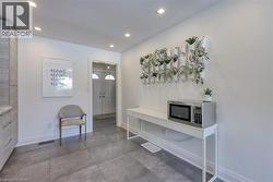 Entrance foyer with baseboards and recessed lighting - 