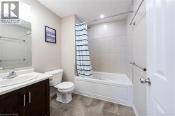 Full bath featuring shower / bath combo and vanity - 