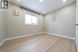 Unfurnished room with light wood finished floors and recessed lighting - 
