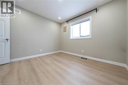 Spare room with light wood finished floors and recessed lighting - 